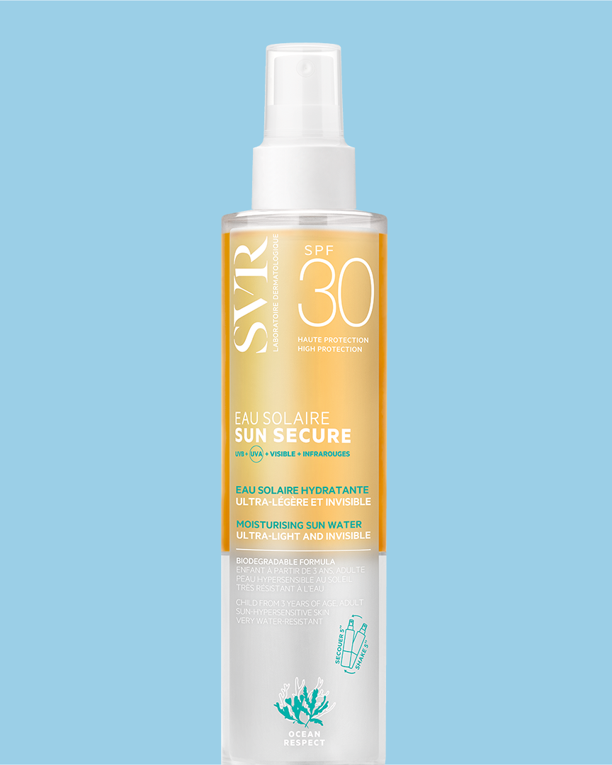 SVR SUN SECURE SPF30 moisturizing sun water spray in a clear bottle with white pump against a light blue background.