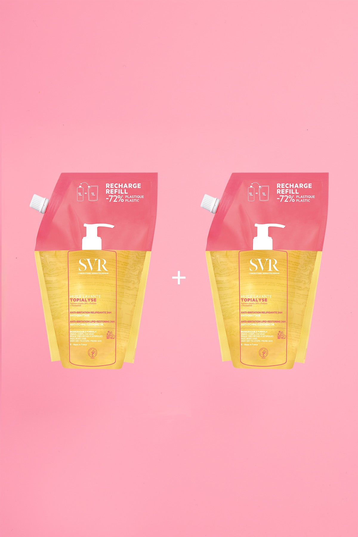 Two 1L SVR Topialyse Huile Lavante refill pouches in yellow and pink packaging on a pink background.