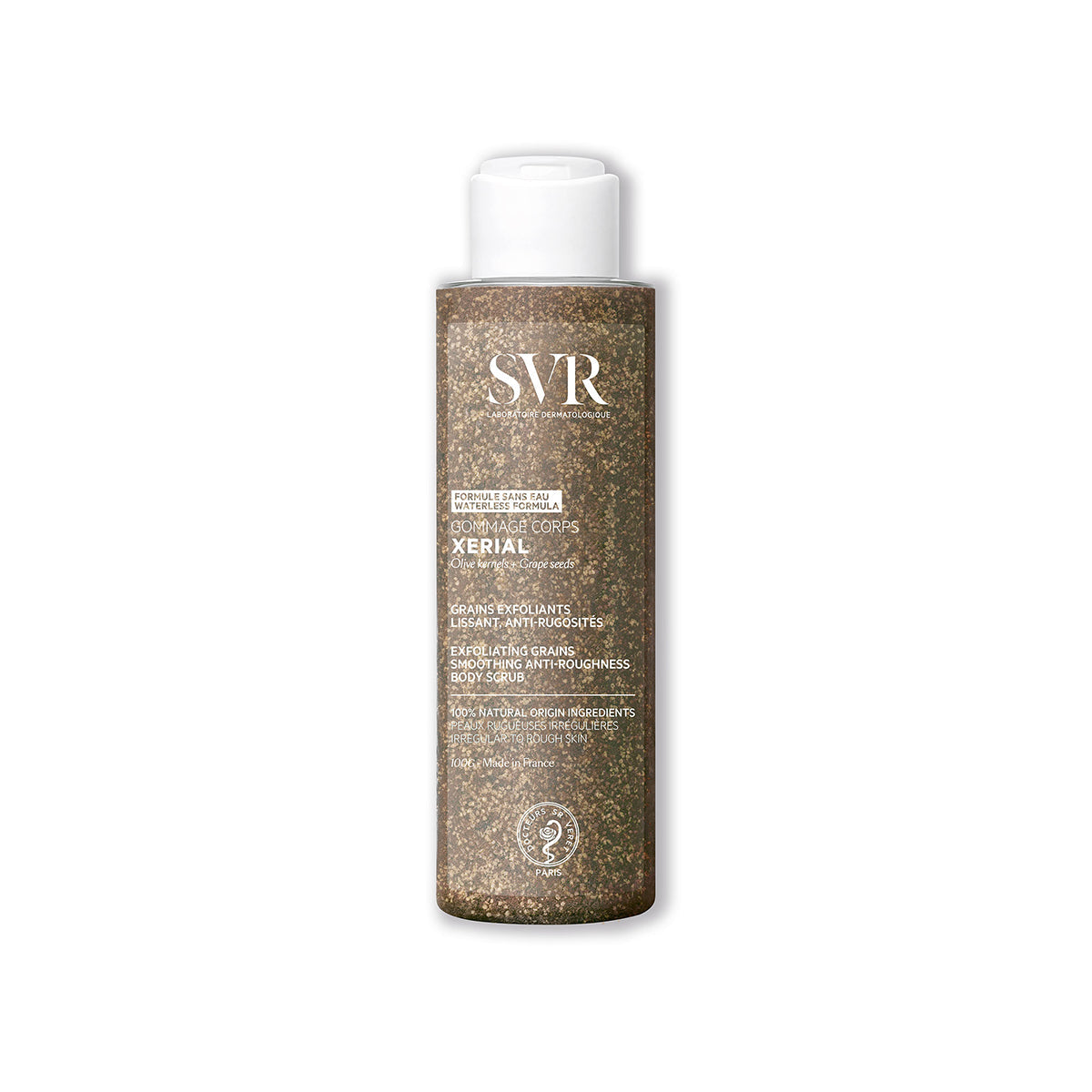 Flacon cylindrique transparent de gommage SVR Xerial rempli de grains exfoliants bruns avec bouchon blanc à clapet.