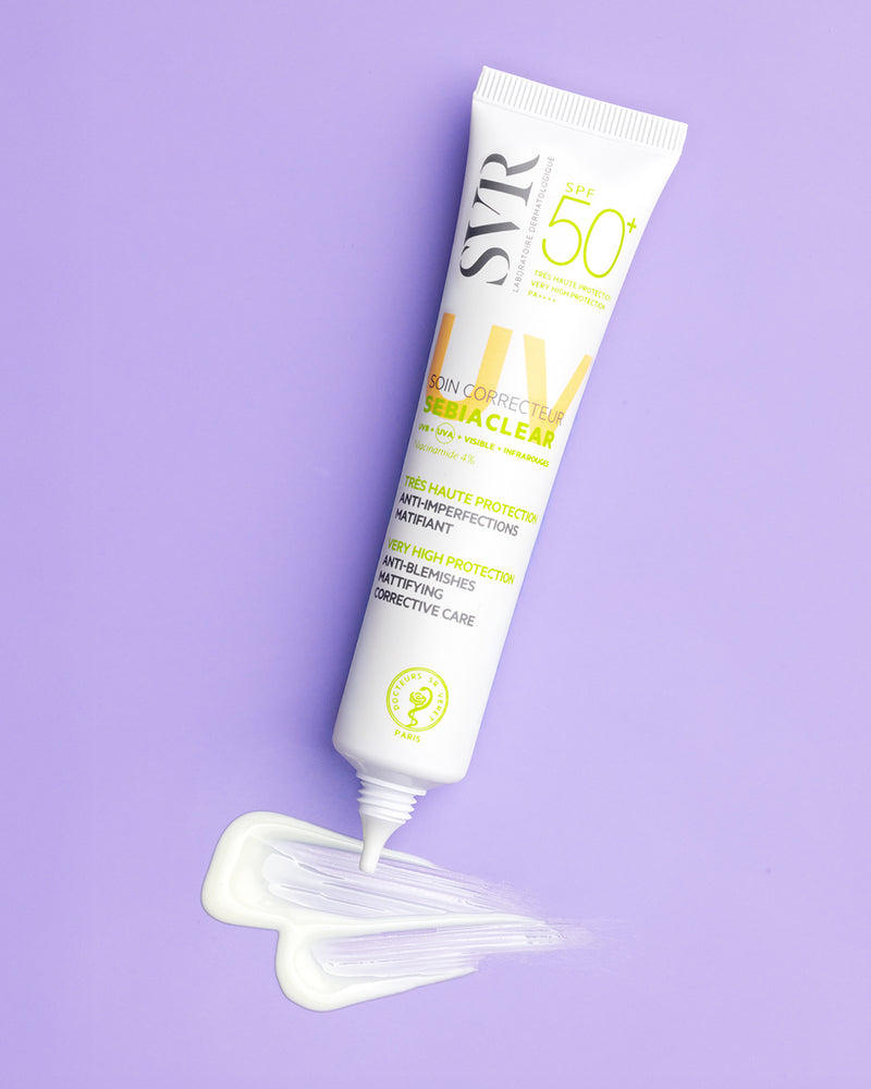 SVR Sebiaclear SPF 50+ mattifying sunscreen tube with a white cream swatch on a light purple background.