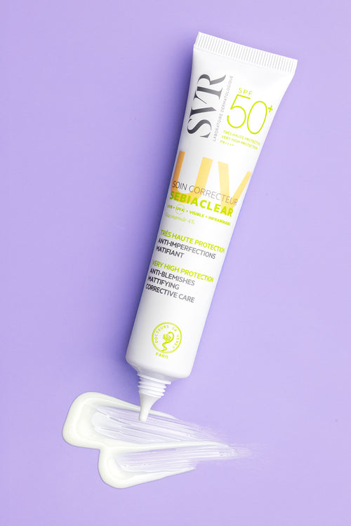 SVR Sebiaclear SPF 50+ mattifying sunscreen tube with a white cream swatch on a light purple background.